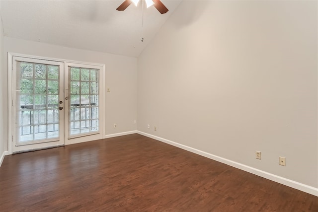 empty room with baseboards, dark wood-type flooring, ceiling fan, and vaulted ceiling