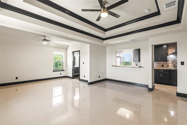 empty room with light tile patterned flooring, visible vents, baseboards, and ceiling fan