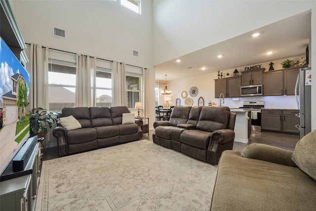 503 Saddle Club Way, Princeton, TX 75407 - living room featuring dark wood-type flooring, a chandelier, visible vents, and recessed lighting
