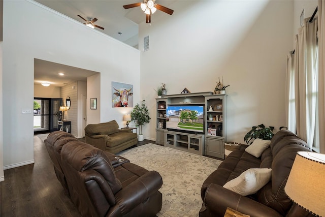 503 Saddle Club Way, Princeton, TX 75407 - living area featuring wood finished floors, ceiling fan, a towering ceiling, baseboards, and visible vents