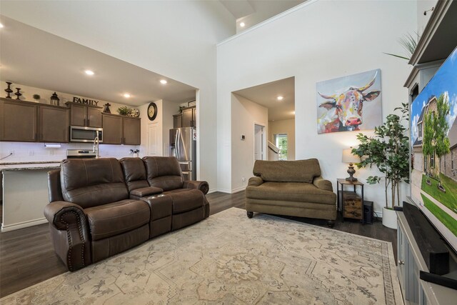 503 Saddle Club Way, Princeton, TX 75407 - living room with recessed lighting, a towering ceiling, baseboards, and dark wood-style flooring