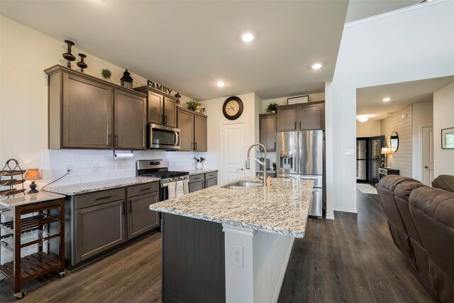 503 Saddle Club Way, Princeton, TX 75407 - kitchen featuring dark brown cabinetry, a sink, appliances with stainless steel finishes, and dark wood-style flooring
