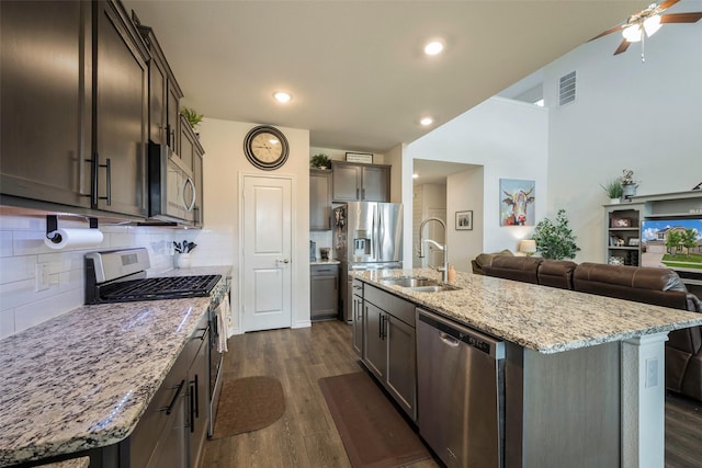 503 Saddle Club Way, Princeton, TX 75407 - kitchen featuring dark wood-style flooring, open floor plan, stainless steel appliances, and a sink