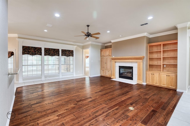 unfurnished living room featuring visible vents, recessed lighting, a ceiling fan, wood finished floors, and a fireplace