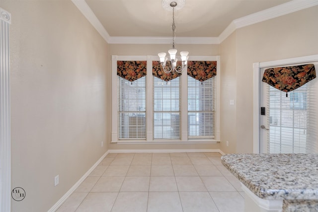 unfurnished dining area with light tile patterned flooring, crown molding, baseboards, and an inviting chandelier