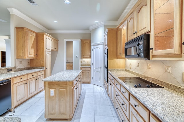 kitchen featuring light brown cabinetry, backsplash, visible vents, light stone countertops, and black appliances