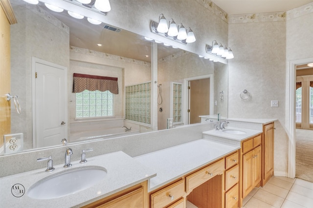 full bathroom featuring tile patterned floors, a sink, visible vents, and double vanity