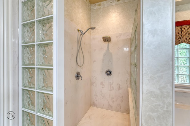 full bathroom with a tile shower