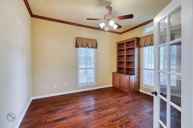 spare room with ceiling fan, baseboards, ornamental molding, and dark wood-type flooring