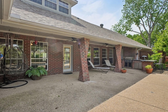 view of patio with grilling area, a ceiling fan, and area for grilling