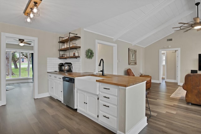 kitchen featuring butcher block counters, dishwasher, ceiling fan, and a sink