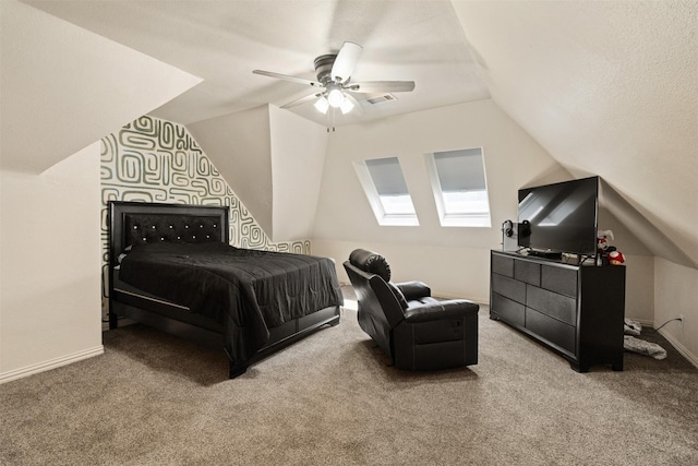 carpeted bedroom with lofted ceiling, visible vents, baseboards, and ceiling fan