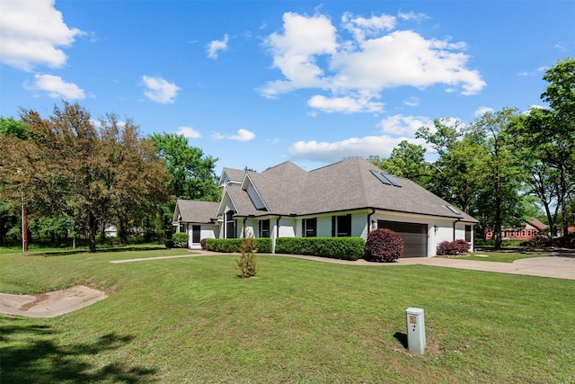 view of front of property featuring an attached garage, a shingled roof, driveway, and a front lawn