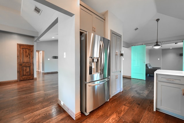kitchen featuring dark wood finished floors, stainless steel fridge, and gray cabinets