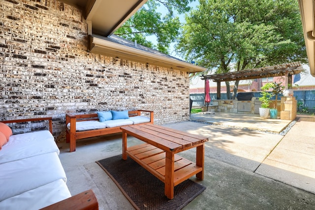 view of patio featuring exterior kitchen, outdoor lounge area, and a pergola