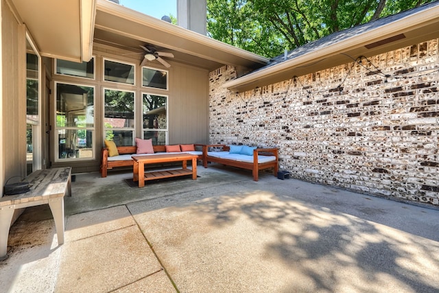view of patio / terrace with an outdoor living space and a ceiling fan
