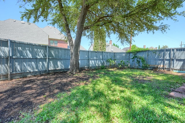 view of yard with a fenced backyard