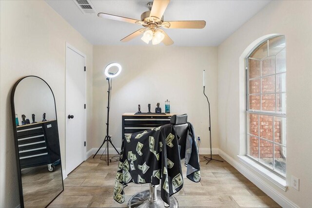 misc room featuring ceiling fan, baseboards, wood finished floors, and visible vents
