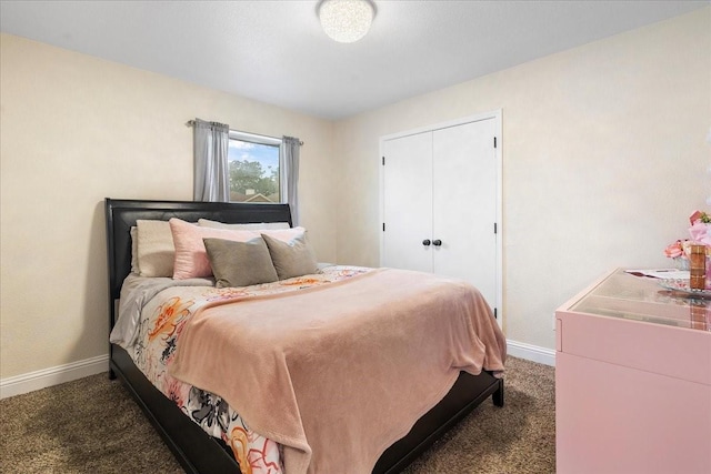bedroom featuring dark carpet, a closet, and baseboards
