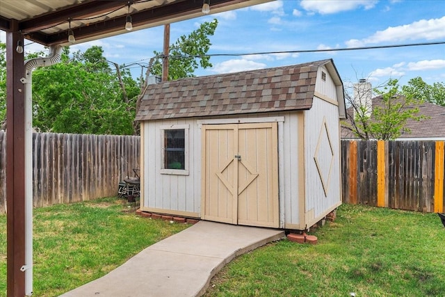 view of shed with a fenced backyard