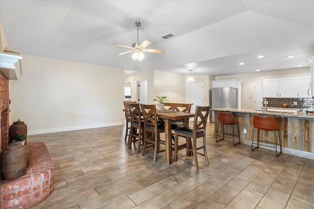 dining space featuring a ceiling fan, light wood-type flooring, baseboards, visible vents, and recessed lighting