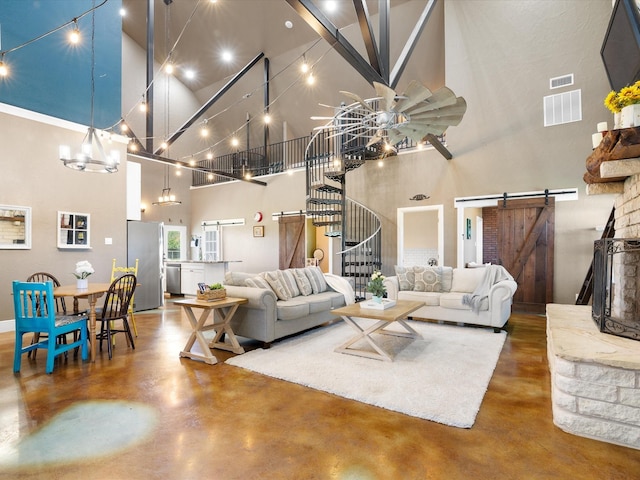 living area with a high ceiling, visible vents, and finished concrete flooring