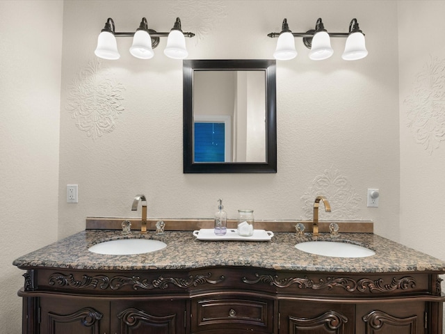 full bathroom featuring a sink and double vanity