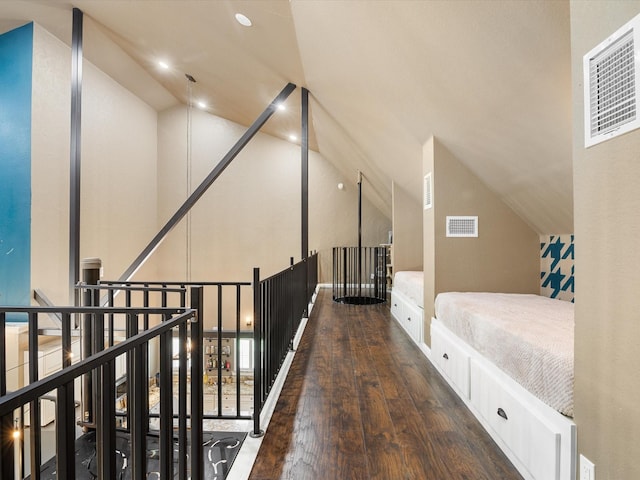 bedroom featuring recessed lighting, lofted ceiling, visible vents, and hardwood / wood-style flooring