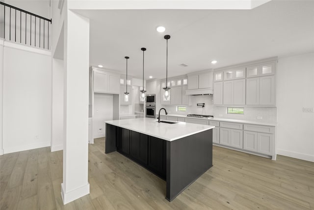 301 E Cheyenne Mountain Cor, Ovilla, TX 75154 - kitchen featuring stainless steel appliances, white cabinets, light wood finished floors, light countertops, and recessed lighting