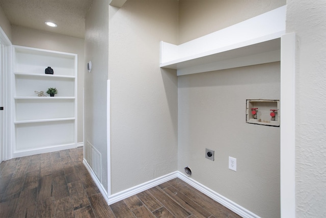 washroom featuring hookup for an electric dryer, dark wood finished floors, baseboards, hookup for a washing machine, and laundry area