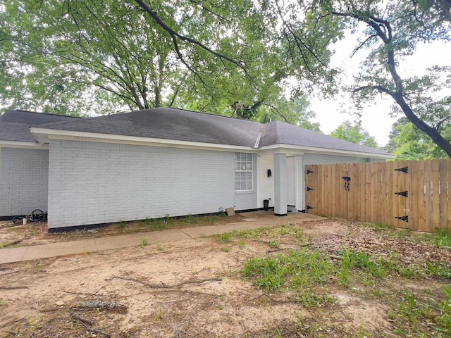 2631 Lillian St, Shreveport, LA 71103 - rear view of house featuring fence and brick siding