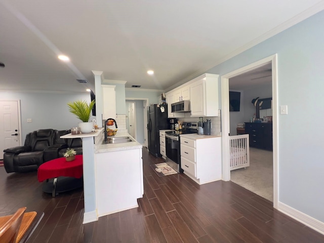 2631 Lillian St, Shreveport, LA 71103 - kitchen featuring light countertops, a sink, appliances with stainless steel finishes, and crown molding