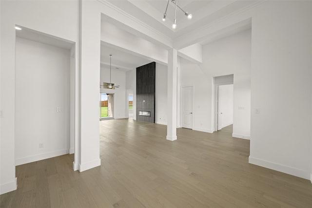 431 Broadmoor, Ovilla, TX 75154 - empty room featuring wood finished floors, a ceiling fan, baseboards, and a high ceiling