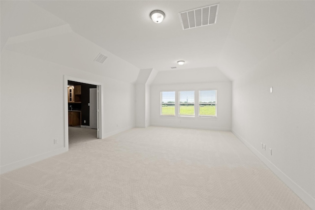 431 Broadmoor, Ovilla, TX 75154 - unfurnished room with lofted ceiling, light colored carpet, and baseboards