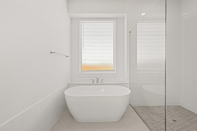 431 Broadmoor, Ovilla, TX 75154 - full bathroom featuring a freestanding bath, walk in shower, and tile patterned flooring