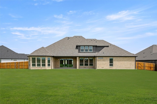 431 Broadmoor, Ovilla, TX 75154 - back of house featuring a shingled roof and brick siding