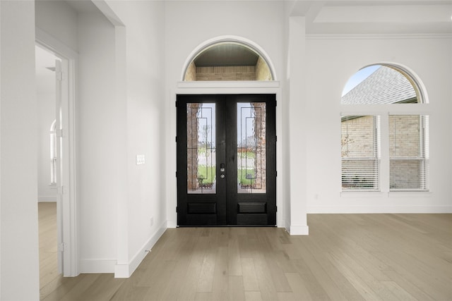 431 Broadmoor, Ovilla, TX 75154 - foyer entrance with wood finished floors, baseboards, healthy amount of natural light, and french doors
