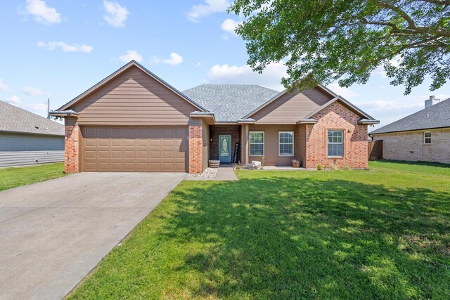 ranch-style home featuring a garage, brick siding, a front yard, and concrete driveway