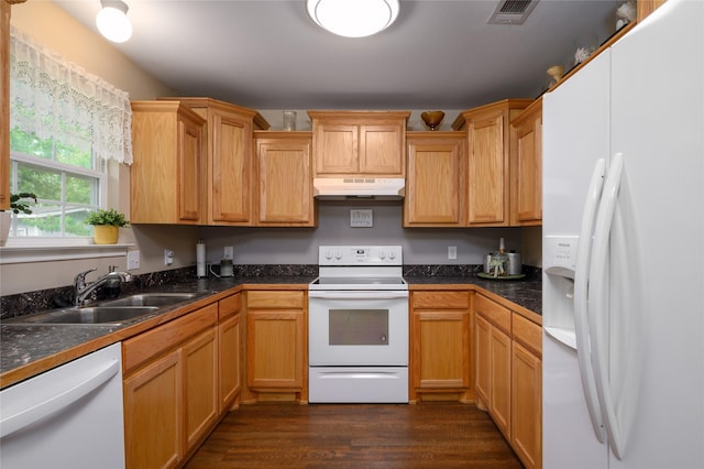 310 Otis St, Whitesboro, TX 76273 - kitchen featuring white appliances, under cabinet range hood, dark wood-style floors, a sink, and dark countertops