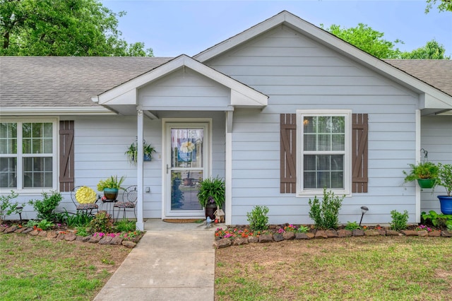310 Otis St, Whitesboro, TX 76273 - view of front of home with roof with shingles, a front yard, and covered porch