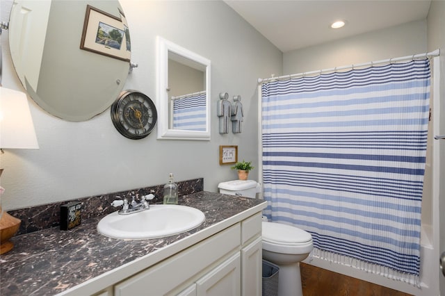 310 Otis St, Whitesboro, TX 76273 - full bath featuring toilet, wood finished floors, vanity, a shower with curtain, and recessed lighting