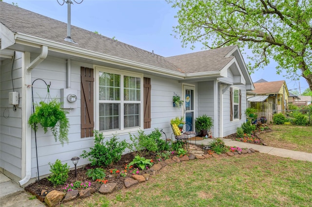 310 Otis St, Whitesboro, TX 76273 - view of side of home with roof with shingles