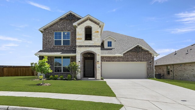 776 Tawny Turn, Lavon, TX 75166 - view of front facade featuring brick siding, stone siding, and roof with shingles