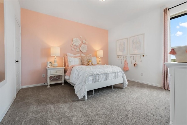 carpeted bedroom with baseboards