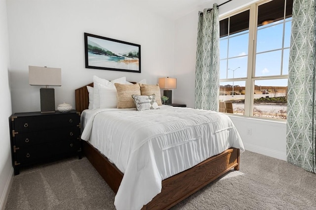 bedroom with carpet and baseboards