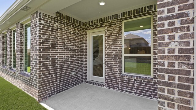 776 Tawny Turn, Lavon, TX 75166 - entrance to property with brick siding and a patio