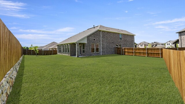 776 Tawny Turn, Lavon, TX 75166 - rear view of house featuring brick siding and a fenced backyard