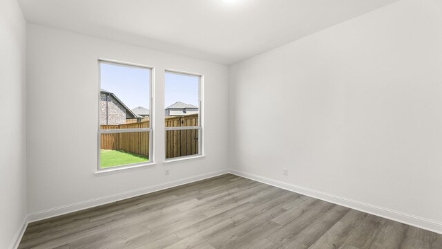 776 Tawny Turn, Lavon, TX 75166 - living room featuring wood finished floors, a stone fireplace, and recessed lighting