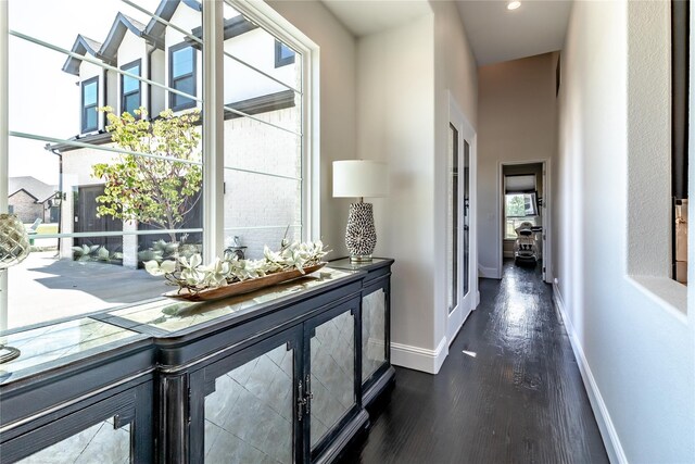 living area with a ceiling fan, visible vents, a fireplace, baseboards, and a tray ceiling