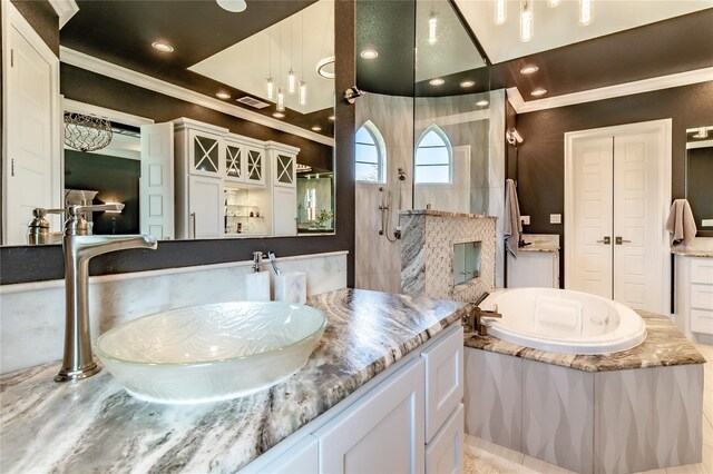 bedroom with ornamental molding, a tray ceiling, wood finished floors, and a notable chandelier